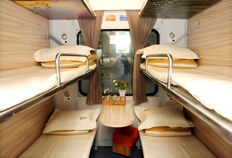 6-Berth Sleeper Giuong Nam Khoang 6 cabin showing three tier berth configuration on overnight train Ho Chi Minh to Da Nang
