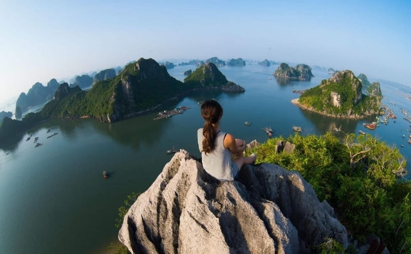 Tourists admiring the stunning landscape of Halong Bay