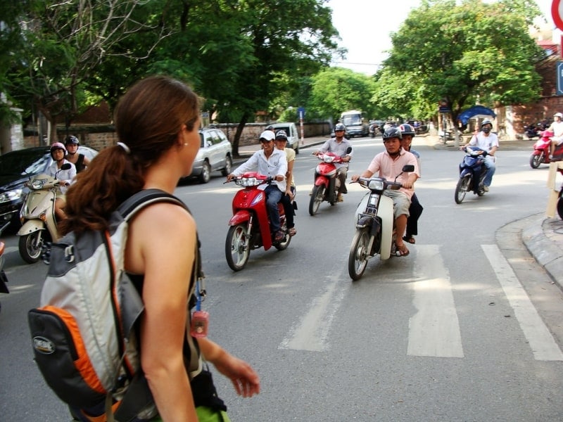 A visitor is trying to cross the road