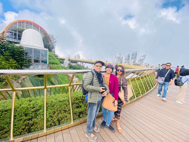 Mr Biplap and his family on Golden Bridge, Da Nang