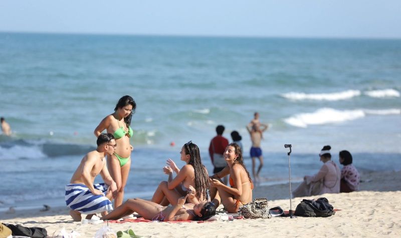 Sunbathing at My Khe Beach