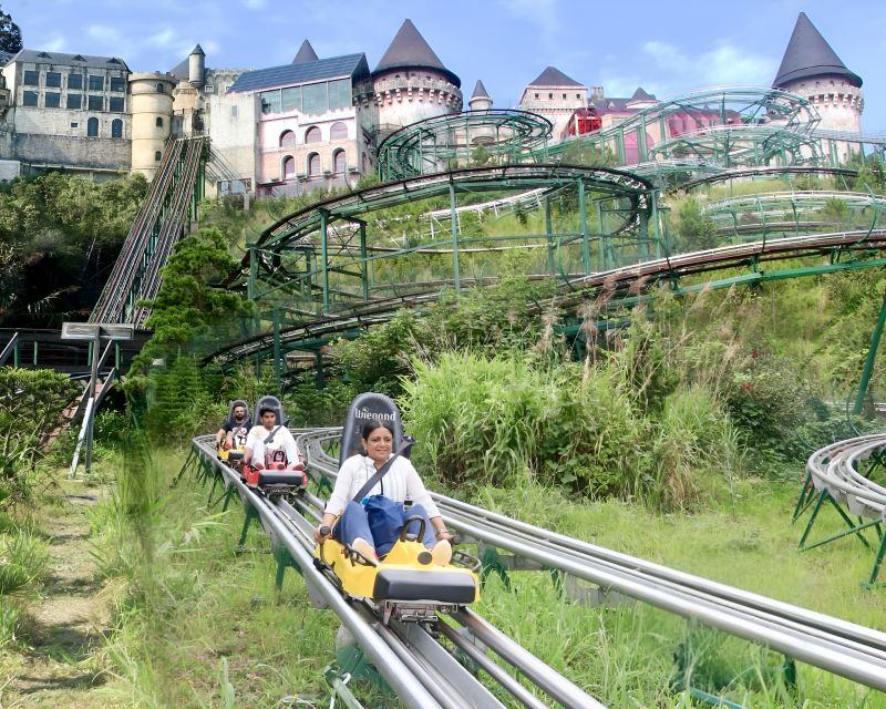 Alpine Coaster at Ba Na Hills single rail descent through forest with rider in cart
