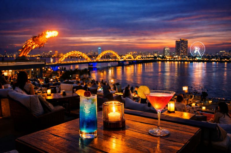 Da Nang rooftop bar terrace with Han River and Dragon Bridge view at evening