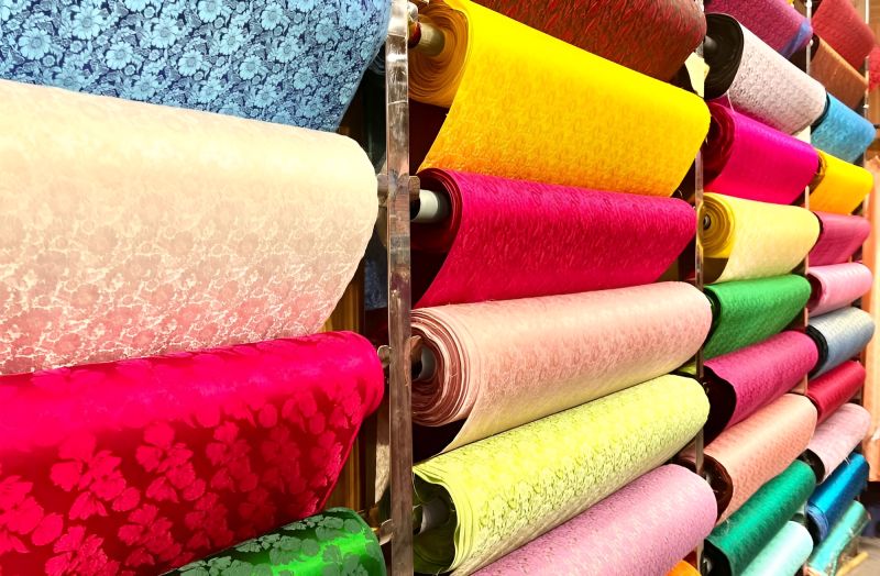 Silk scarves and áo dài fabric from Hội An Đà Lạt at Ben Thanh Market textile stall raw silk