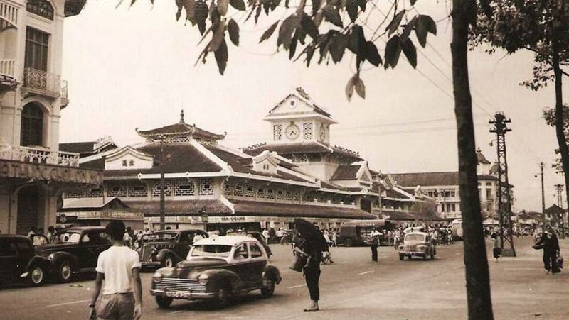 Binh Tay Market 1928 heritage building exterior with Guangdong-style upturned roof eaves and 4 entrance gate towers built by Quach Dam