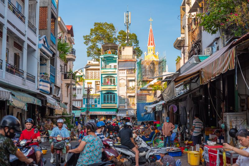 Binh Tay Market layout street view in Cho Lon District 6 showing market surrounding lanes and Catholic church in background