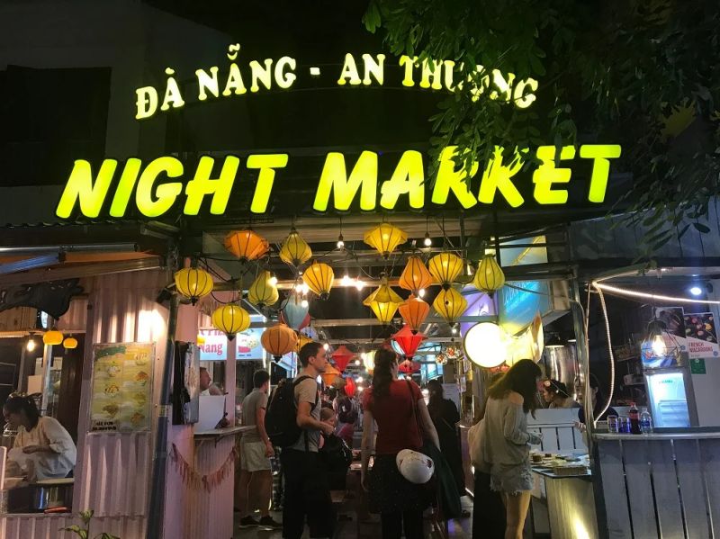 An Thuong Night Market Da Nang at night with food stalls and souvenir vendors on pedestrian street