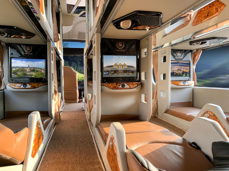 Phuong Trang Futa sleeper bus interior with reclined berth seats Indian tourists use on the overnight Da Nang to Da Lat route