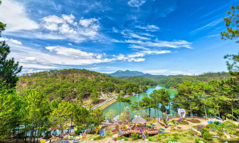 Historic view of Dalat Valley of Love showing the original French colonial Vallée d'Amour landscape with pine hills surrounding Da Thien Lake