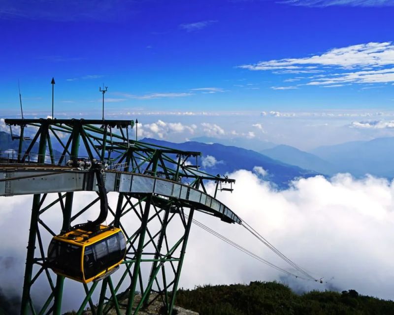 Fansipan Mountain monsoon season cable car ride above cloud sea while trekking trails are wet and risky between May and September