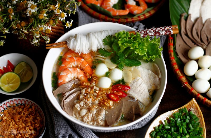 Street food stalls near Binh Tay Market in Cho Lon serving Vietnamese-Chinese dishes including Hu Tieu Nam Vang and Banh Cuon