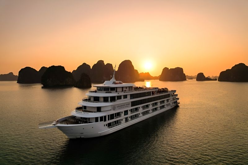 Ha Long Bay cruise limestone karsts Vietnam sunset — UNESCO heritage seascape for Indian travelers