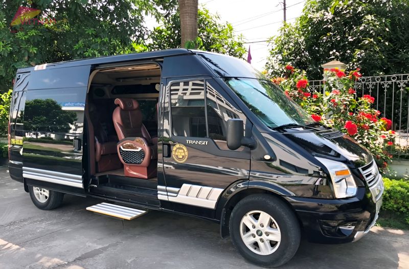 Black Ford Transit limousine van with leather seats and open sliding door for Hanoi to Ninh Binh transfer