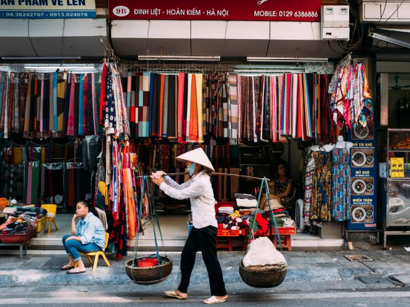 Hanoi Old Quarter daytime walking tour vs weekend Hanoi Walking Street comparison showing same guild-street geography in different operating windows