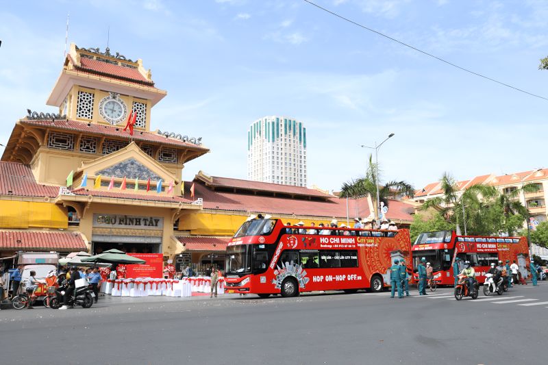 Cholon Binh Tay Market District 5 wholesale fabric lanes with ceramic stalls and local Chinese-Vietnamese vendors