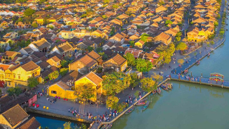 Da Nang Dragon Bridge, Hoi An lanterns, Hue Imperial Citadel, and Ninh Binh Tam Coc must-see stops between Ho Chi Minh and Hanoi