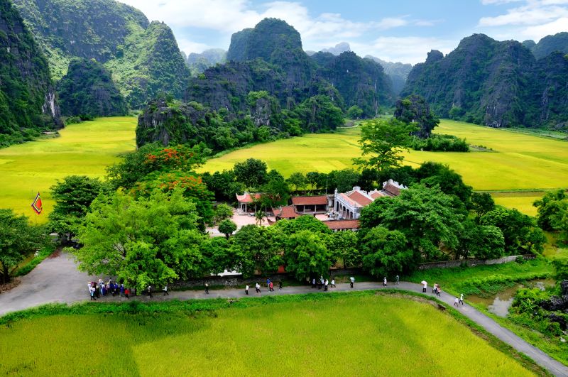 Trang An UNESCO World Heritage Site rowing boat passing through limestone caves near Hoa Lu Ancient Capital