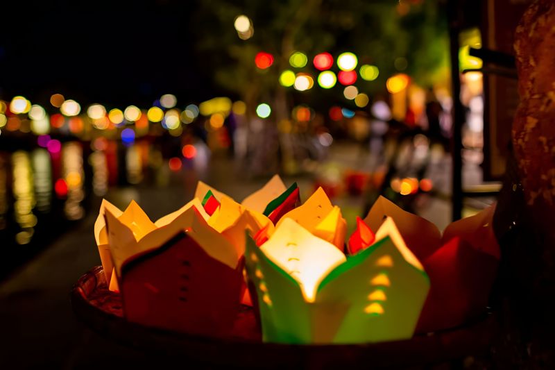 Paper lanterns at Hoi An riverside vendor stall on festival night