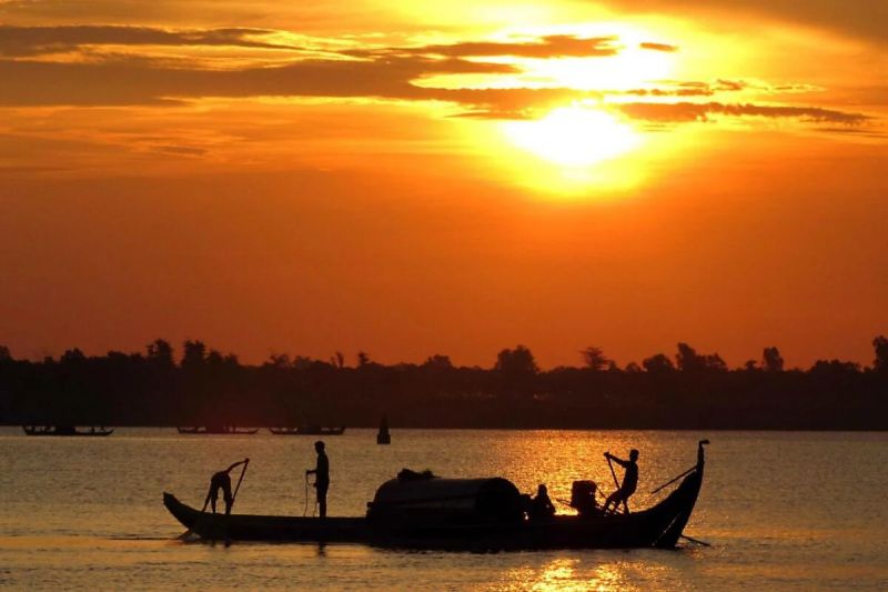 June in Cambodia — quiet Angkor Wat sunrise during early monsoon with under 2,000 daily tickets sold