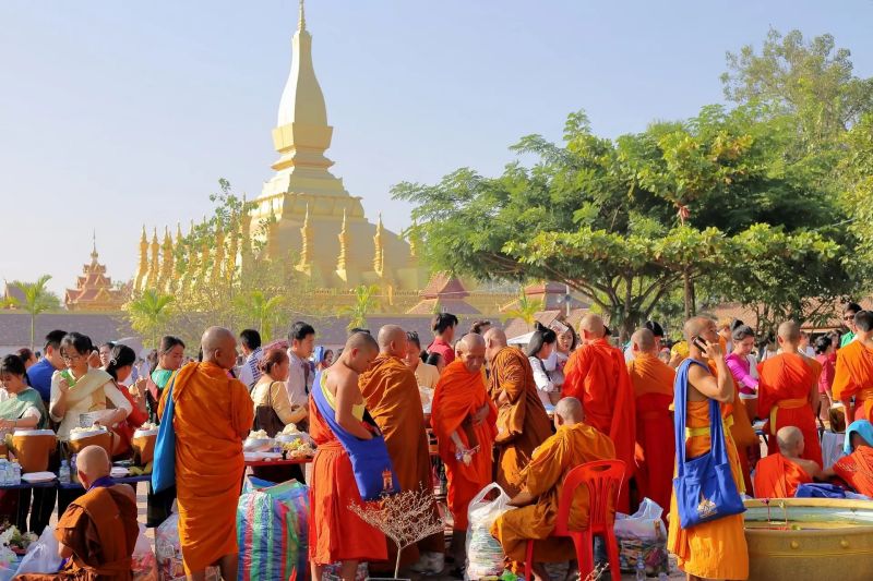 Laos festivals showing Pi Mai Lao water festival celebration in Luang Prabang street comparable to Holi for Indian tourists