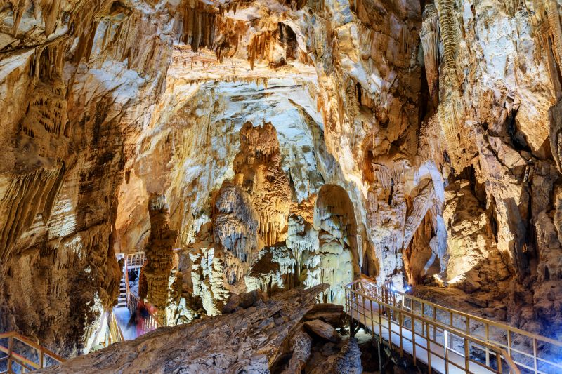 Phong Nha-Ke Bang UNESCO World Heritage Site Vietnam — illuminated stalactites and stalagmites inside a karst cave at Quang Binh province