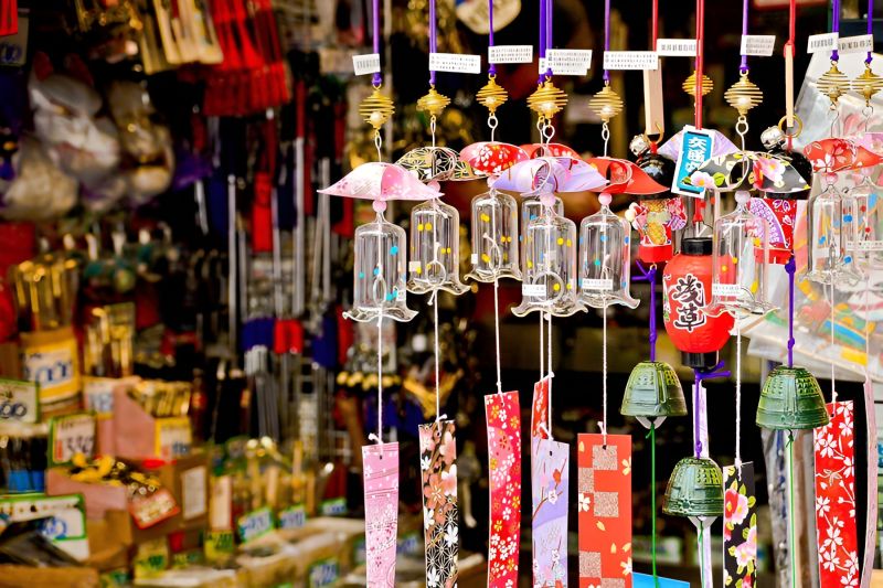 Phu Quoc souvenirs handicrafts display including seashell art lacquerware embroidered pouches miniature fishing boats