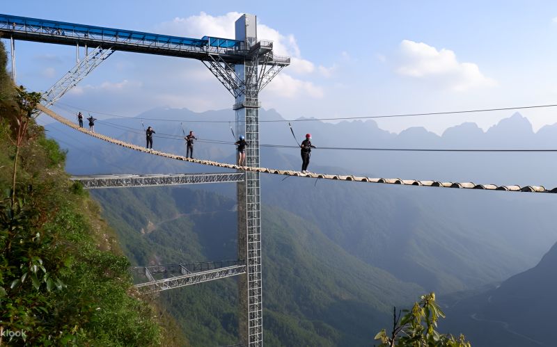 Rong May Glass Bridge Invisible suspension bridge 200-metre wooden walkway above forest canopy on O Quy Ho Pass