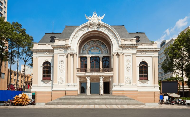 Saigon Opera House Flamboyant facade close-up Caryatid stone figures 3 arched entrances ornate balustrades