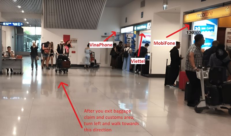 Tan Son Nhat Airport international arrivals hall showing Vinaphone, Viettel, and Mobifone SIM card counter locations with directional arrows after baggage claim exit