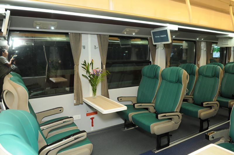 Soft Seat AC Ngoi Mem Dieu Hoa class with padded reclining seats on Reunification Express Ho Chi Minh to Da Nang train