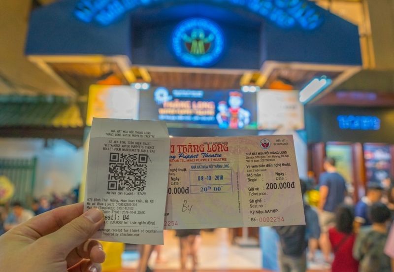 Thang Long Water Puppet Theater ticket booth display showing 3 seat tiers and prices for Indian tourists in INR
