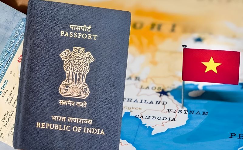 Indian passport with Vietnam flag illustrating e-visa USD 25 single-entry valid 90 days for Indian citizens 2026