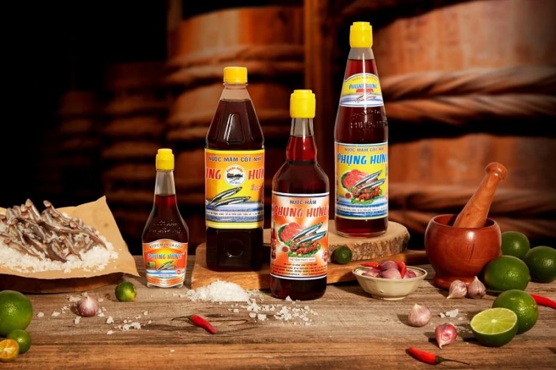 Vietnamese fish sauce bottles with anchovies garlic chili and lime ingredients