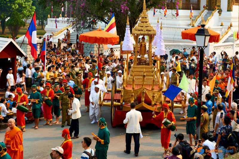 When to go to Laos from India showing Indian tourist family with luggage at airport ready for Diwali or Christmas Indochina trip